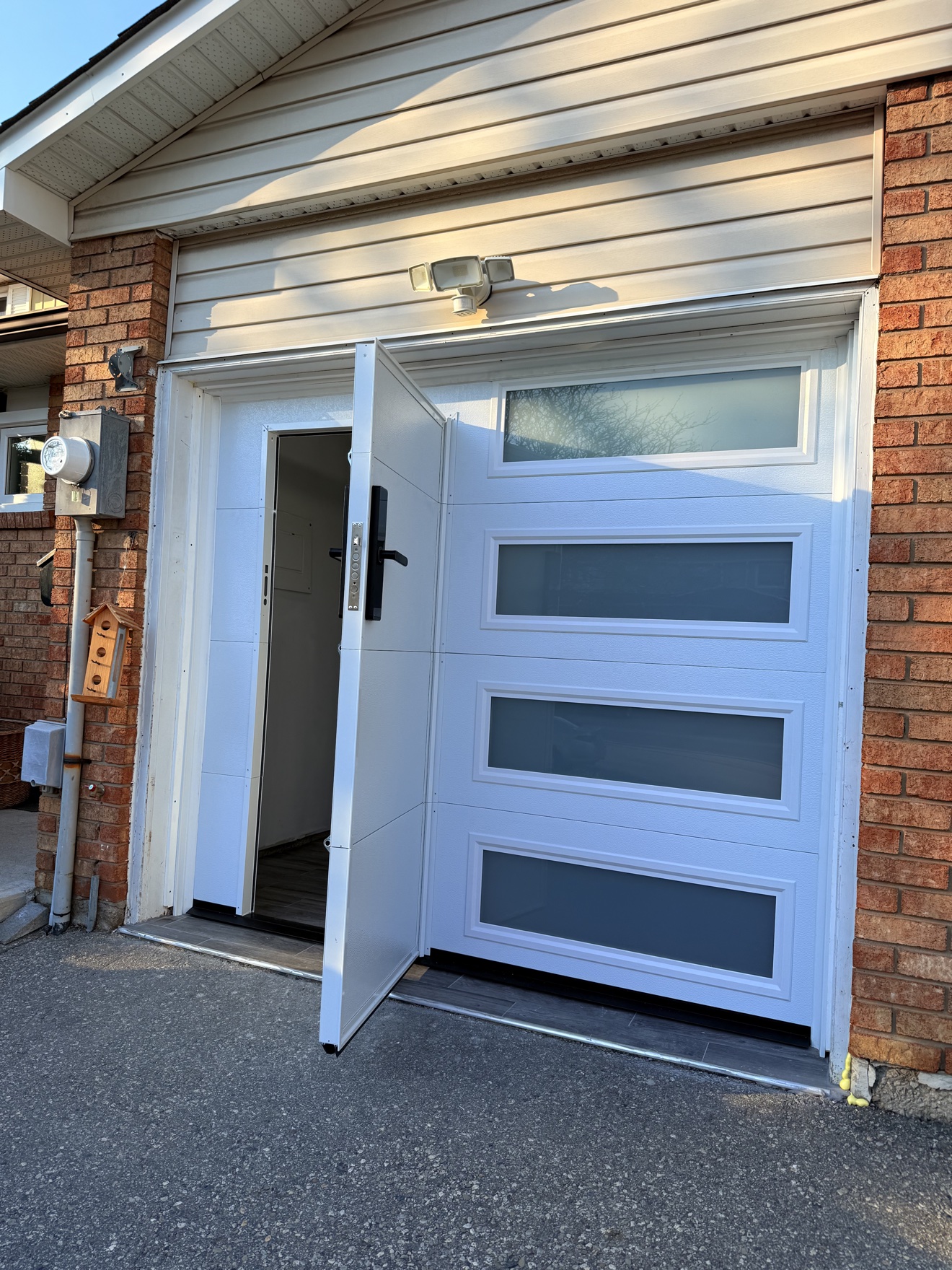 Garage door with a built-in walk-through pedestrian door