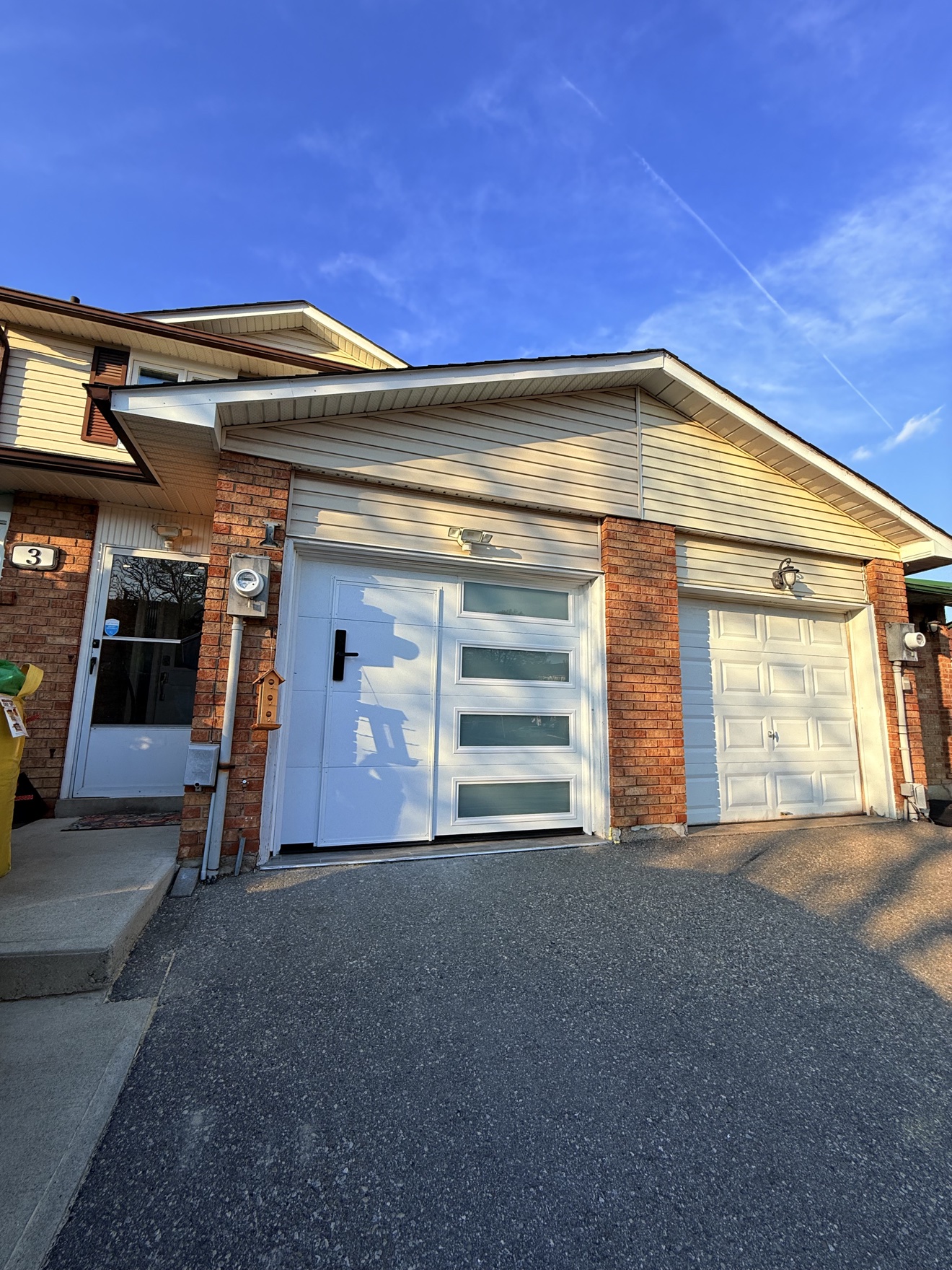White walk-through garage door, closed